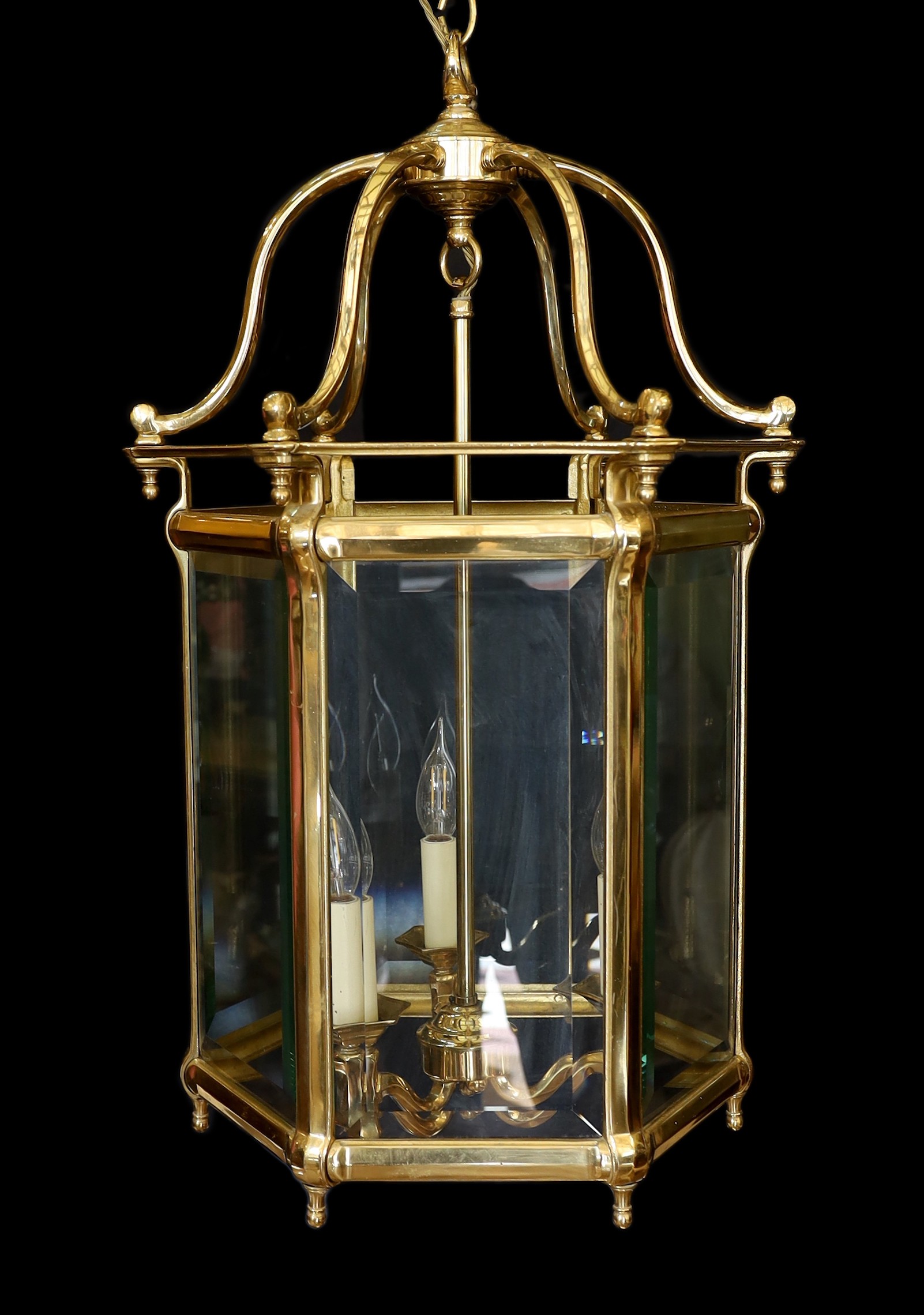 A large 18th century style hexagonal brass hall lantern with bevelled glass panels, height 78cm. width 48cm